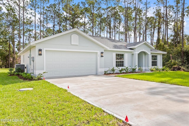 single story home with central AC unit, a garage, and a front yard