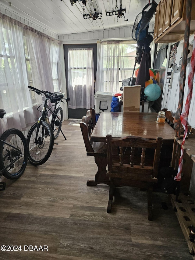 dining room featuring hardwood / wood-style floors and wooden ceiling