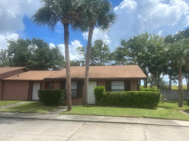 single story home with a front yard