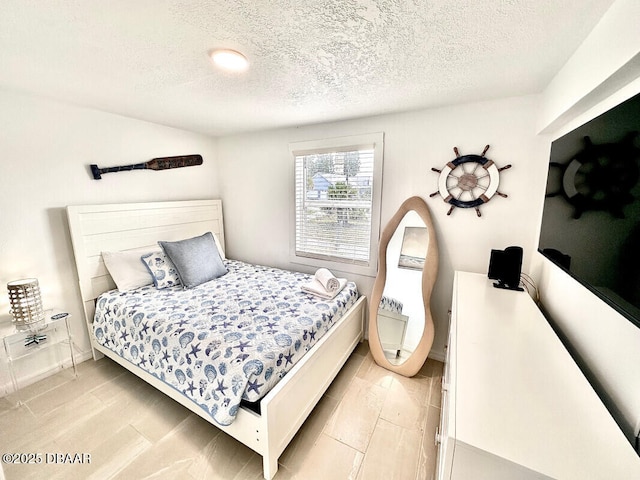 bedroom featuring a textured ceiling