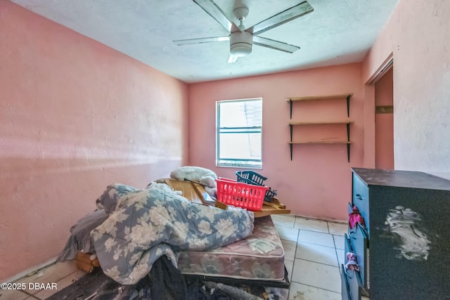 4519 Saxon Dr, New Smyrna Beach, FL 32169 - bedroom featuring a ceiling fan and tile patterned flooring