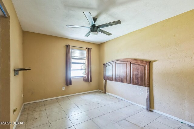 4519 Saxon Dr, New Smyrna Beach, FL 32169 - empty room featuring a ceiling fan and light tile patterned floors