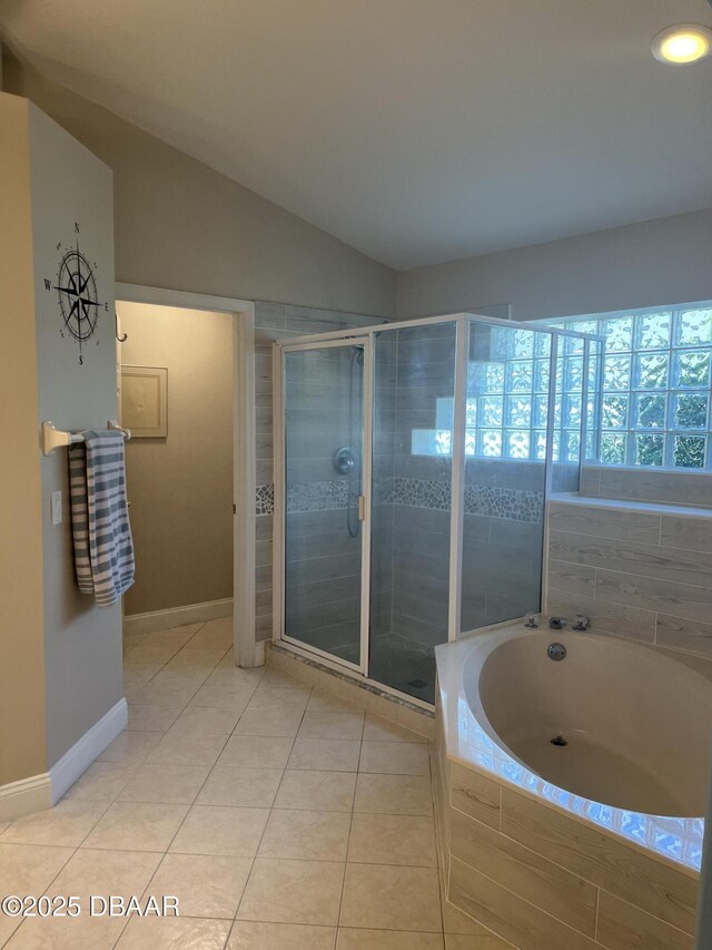 5988 Heron Pond Dr, Port Orange, FL 32128 - bathroom with a bath, a stall shower, tile patterned flooring, vaulted ceiling, and recessed lighting