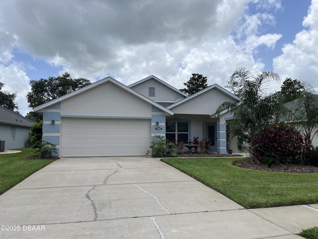 5988 Heron Pond Dr, Port Orange, FL 32128 - ranch-style house featuring a garage, driveway, a front lawn, and stucco siding