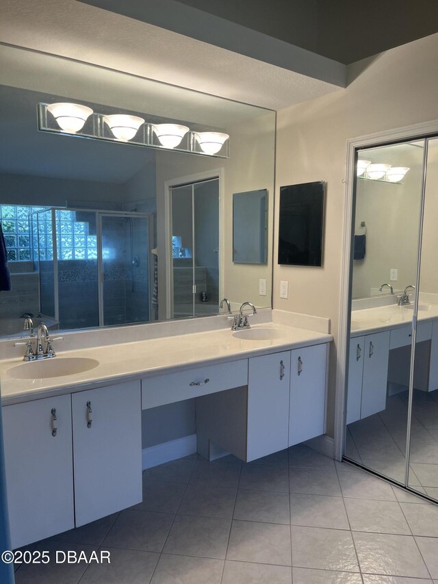 5988 Heron Pond Dr, Port Orange, FL 32128 - full bath with double vanity, tile patterned flooring, and a shower stall