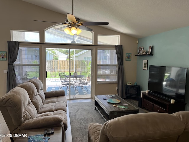 5988 Heron Pond Dr, Port Orange, FL 32128 - living area with vaulted ceiling, plenty of natural light, ceiling fan, and a textured ceiling