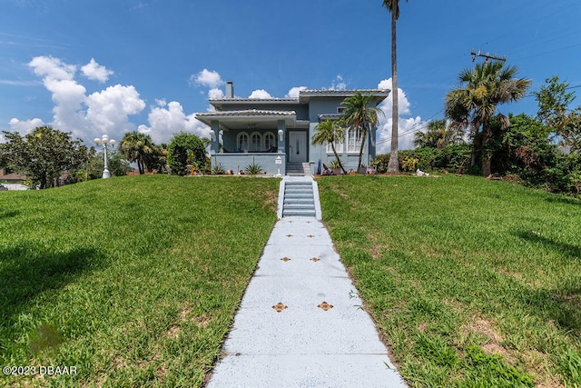 view of front of home featuring a front lawn