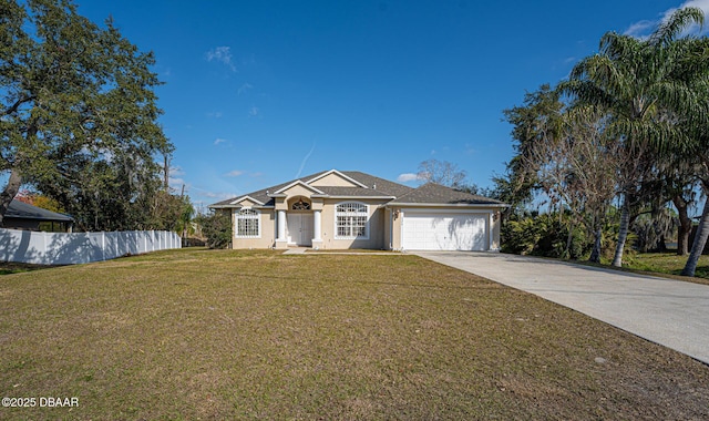 view of front of property featuring a garage and a front yard