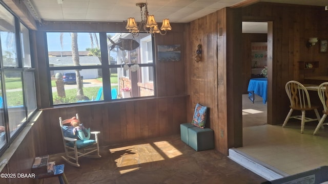 179 Ponce De Leon Dr, Ormond Beach, FL 32176 - sunroom with wood walls, a chandelier, and a water view