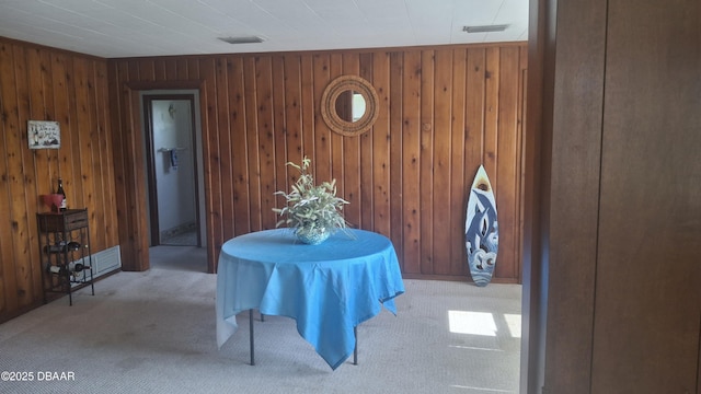 179 Ponce De Leon Dr, Ormond Beach, FL 32176 - carpeted dining room featuring wooden walls