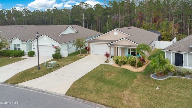 view of front of property featuring a garage and a front yard