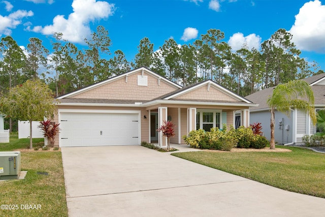 view of front facade with a garage and a front lawn