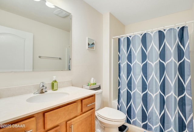 bathroom featuring toilet and vanity