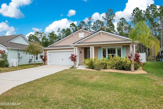 view of front facade with a garage and a front lawn