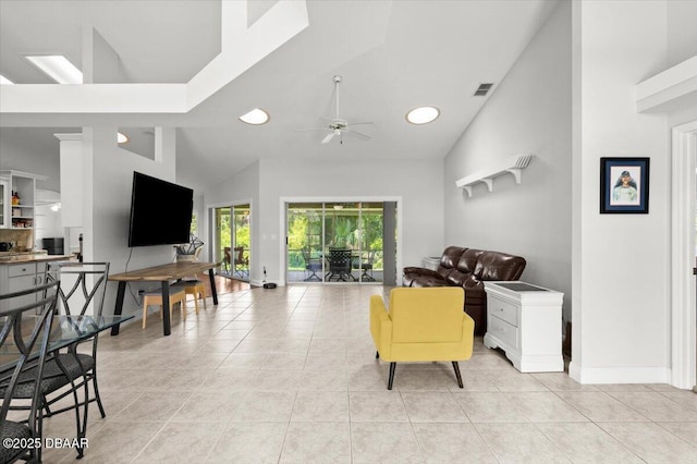 5935 Shady Creek Ln, Port Orange, FL 32128 - living room with ceiling fan, light tile patterned floors, high vaulted ceiling, baseboards, and recessed lighting