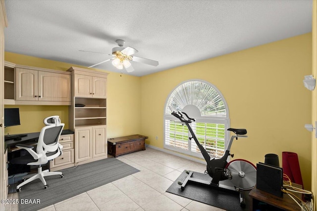 5935 Shady Creek Ln, Port Orange, FL 32128 - home office featuring ceiling fan, light tile patterned flooring, and a textured ceiling