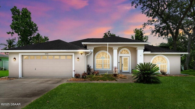 5935 Shady Creek Ln, Port Orange, FL 32128 - single story home featuring stucco siding, concrete driveway, an attached garage, and a lawn