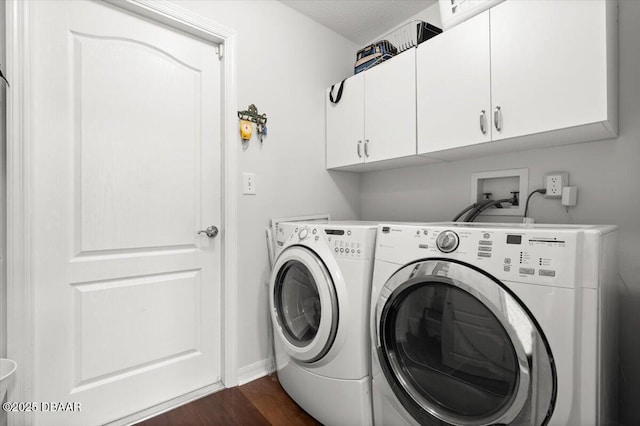 5935 Shady Creek Ln, Port Orange, FL 32128 - laundry area with cabinet space, washer and clothes dryer, dark wood-style floors, and baseboards