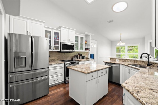 5935 Shady Creek Ln, Port Orange, FL 32128 - kitchen with stainless steel appliances, lofted ceiling, white cabinets, a chandelier, and a sink