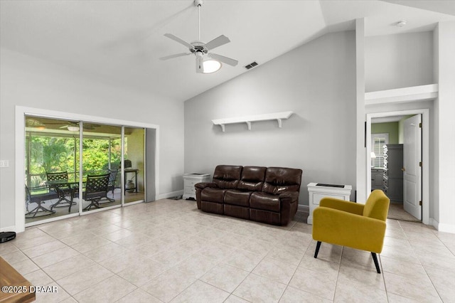 5935 Shady Creek Ln, Port Orange, FL 32128 - living room featuring ceiling fan, baseboards, light tile patterned floors, and high vaulted ceiling