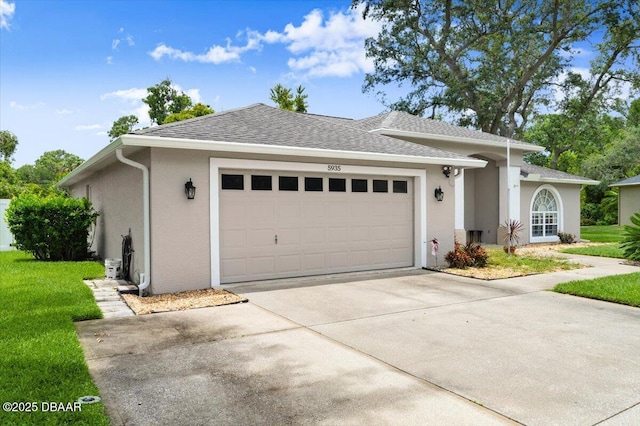 5935 Shady Creek Ln, Port Orange, FL 32128 - view of front facade with stucco siding, a garage, concrete driveway, and a front lawn