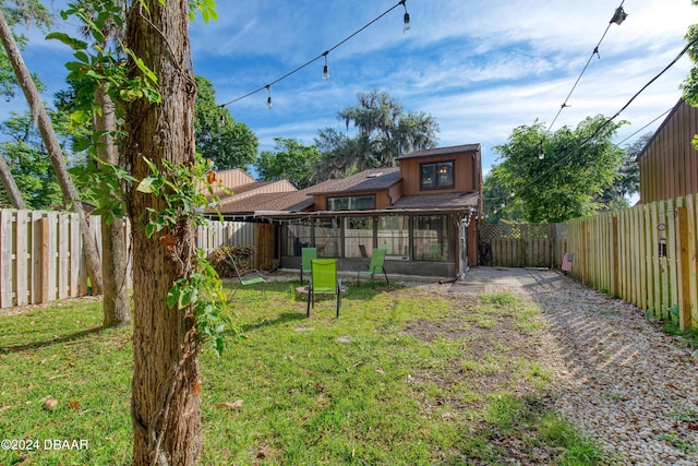 view of yard featuring a sunroom