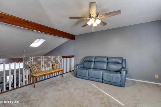 living area with carpet flooring, ceiling fan, and lofted ceiling with skylight