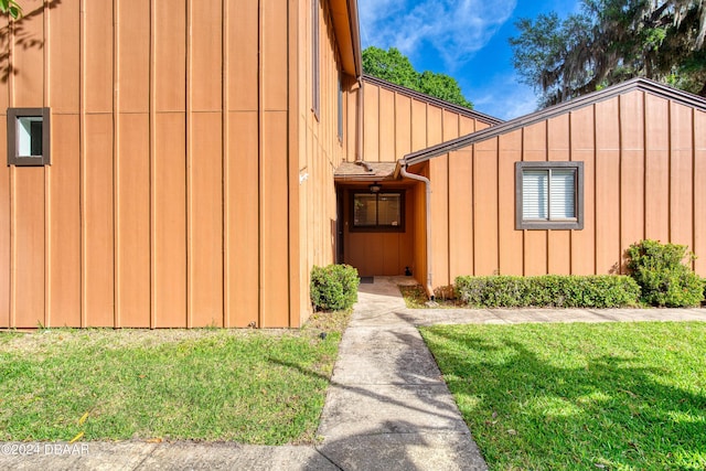 view of home's exterior with a yard