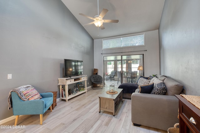 living room with light hardwood / wood-style flooring, high vaulted ceiling, and ceiling fan