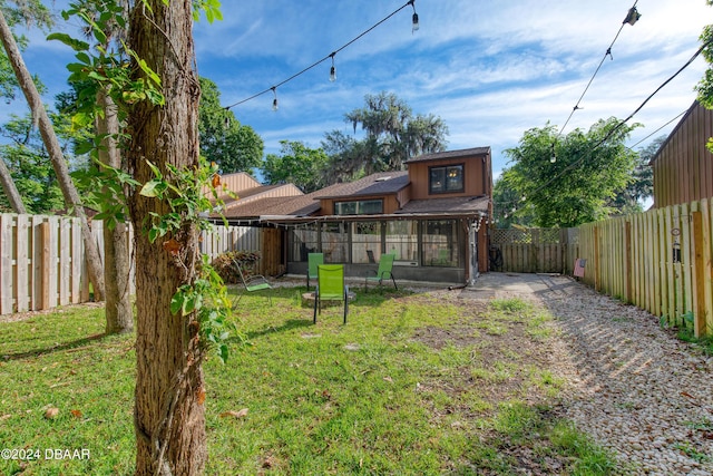 view of yard with a sunroom