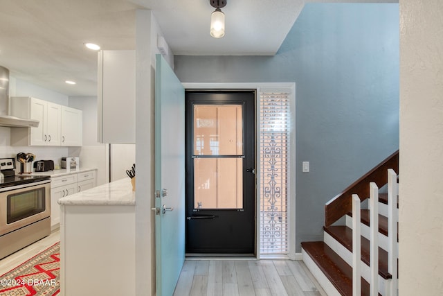 entrance foyer featuring light hardwood / wood-style floors