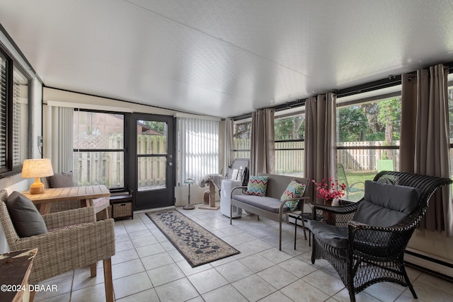 sunroom / solarium featuring a baseboard radiator