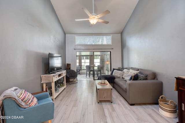 living room featuring french doors, light hardwood / wood-style flooring, high vaulted ceiling, and ceiling fan