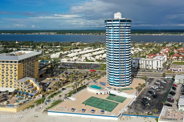 birds eye view of property with a water view