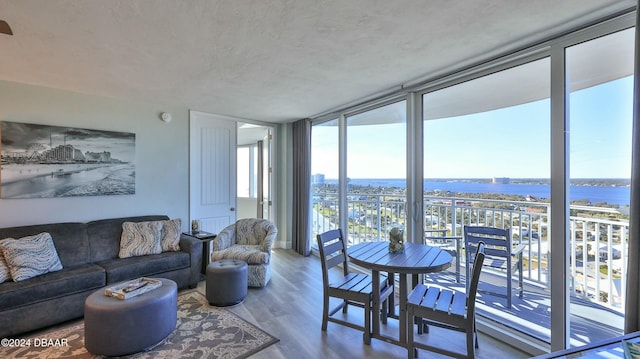 2625 S Atlantic Ave Unit 18Sw, Daytona Beach, FL 32118 - living room with hardwood / wood-style flooring, a wall of windows, and a water view