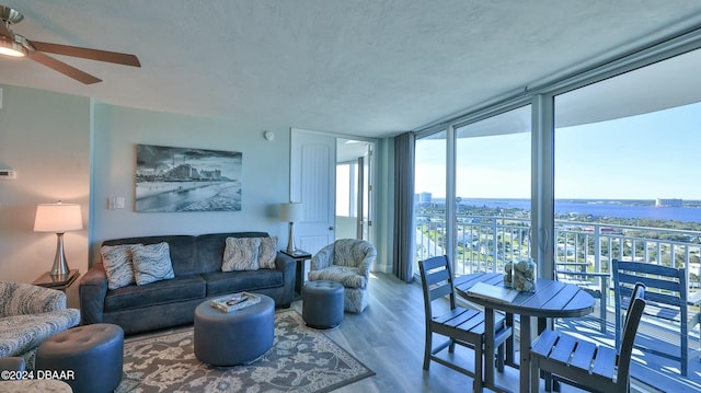 2625 S Atlantic Ave Unit 18Sw, Daytona Beach, FL 32118 - living room with floor to ceiling windows, ceiling fan, and wood-type flooring