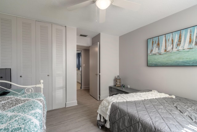 bedroom with ceiling fan, a closet, and light wood-type flooring