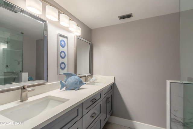 bathroom featuring an enclosed shower and vanity