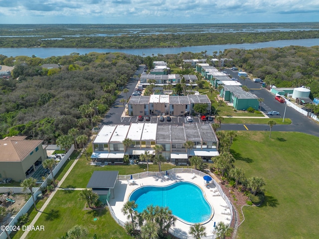 birds eye view of property with a water view