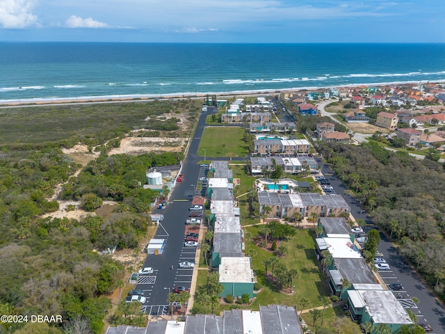 drone / aerial view featuring a view of the beach and a water view