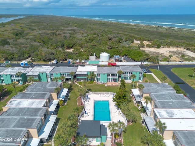 birds eye view of property featuring a view of the beach and a water view