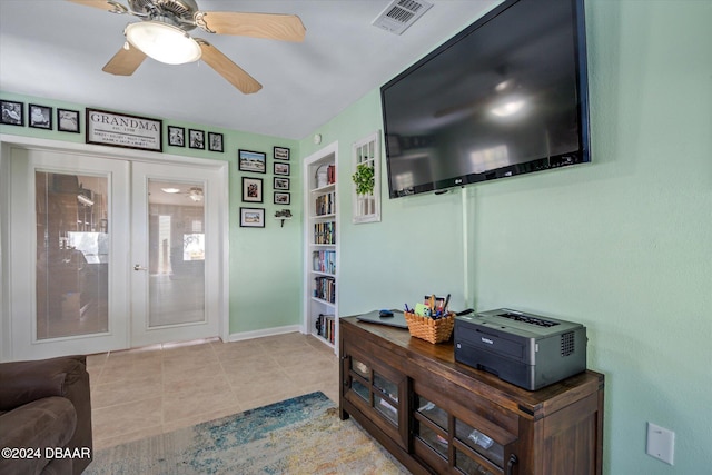 interior space featuring ceiling fan and french doors