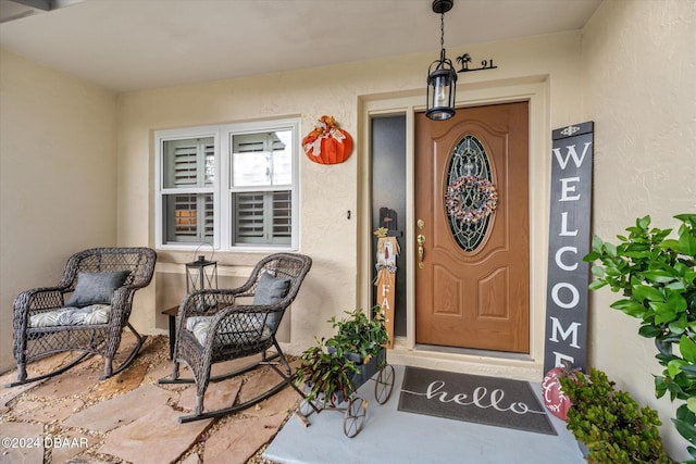 property entrance featuring covered porch