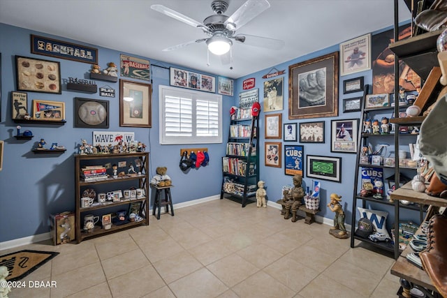 interior space featuring ceiling fan and light tile patterned floors