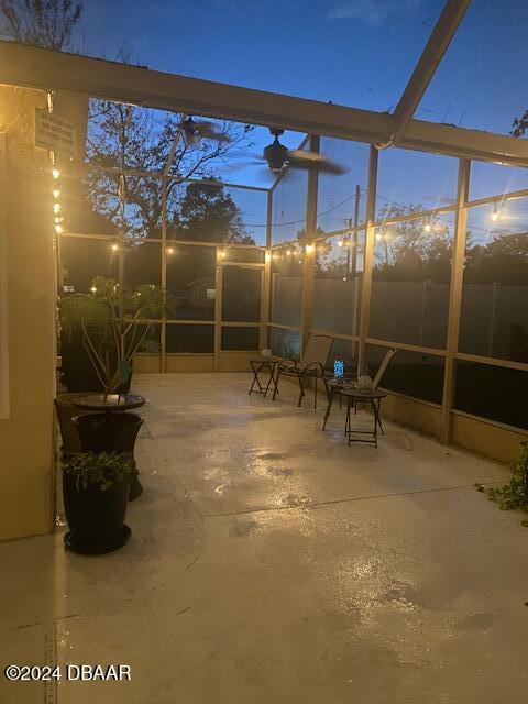 view of patio terrace at dusk