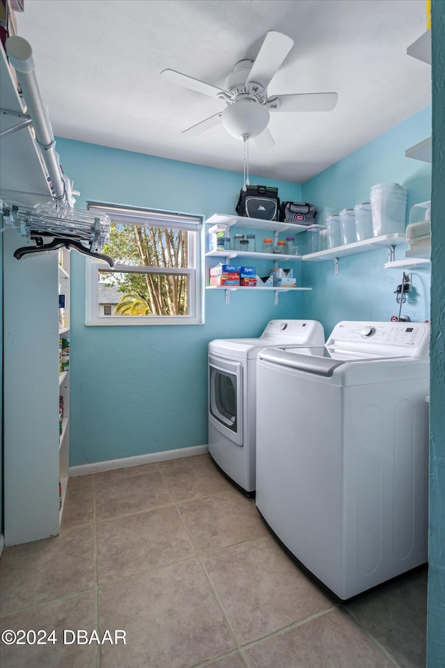 clothes washing area featuring washer and clothes dryer, ceiling fan, and light tile patterned floors