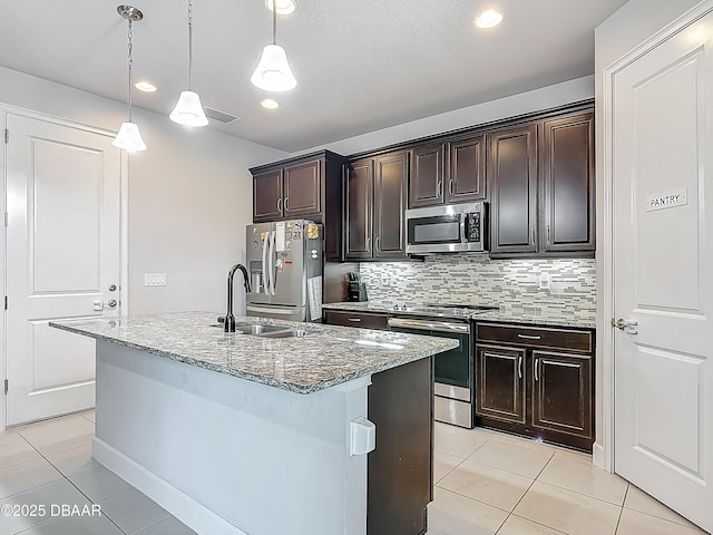 200 Azure Mist Way, Daytona Beach, FL 32124 - kitchen with stainless steel appliances, light tile patterned floors, a sink, light stone countertops, and recessed lighting
