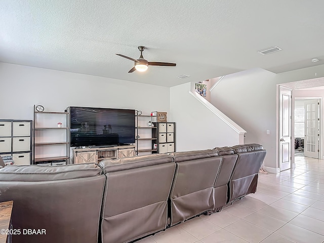 200 Azure Mist Way, Daytona Beach, FL 32124 - living area featuring ceiling fan, light tile patterned floors, and a textured ceiling