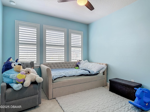 200 Azure Mist Way, Daytona Beach, FL 32124 - carpeted bedroom featuring multiple windows, ceiling fan, and a textured ceiling