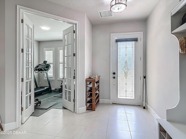 200 Azure Mist Way, Daytona Beach, FL 32124 - entrance foyer featuring plenty of natural light, baseboards, and a textured ceiling